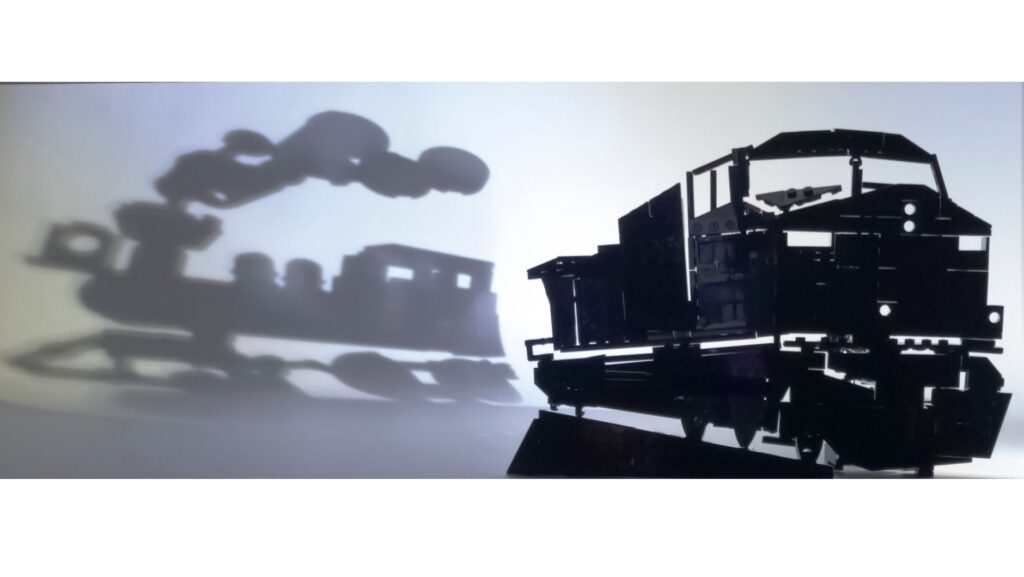 The shadows of the past are ever-present in this LEGO shadow sculpture